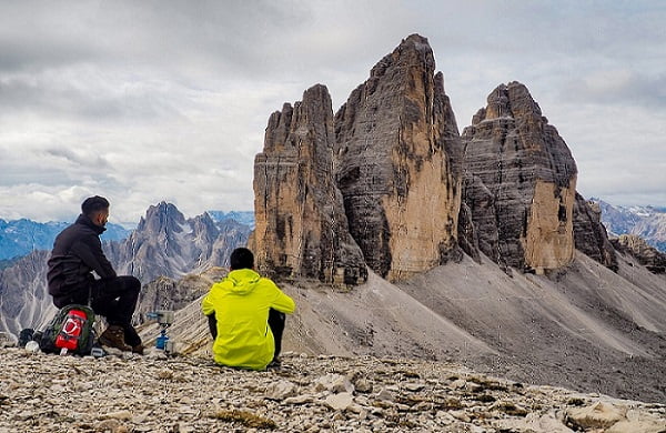 When to hire first employee - superboss hiring - two men in the mountains