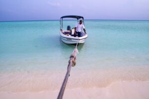 A man on a boat on the seashore - increasing demo requests