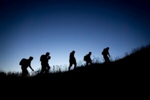 Customer Service Team Walking up a Hill