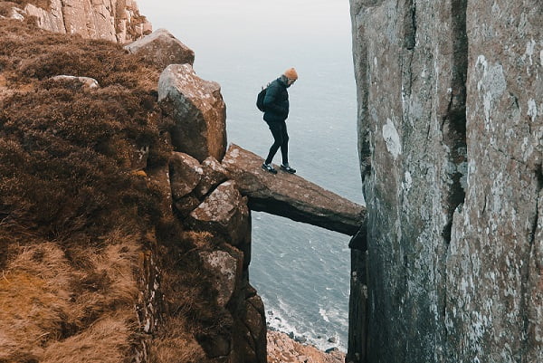 Entrepreneur taking risk walking over an abbys